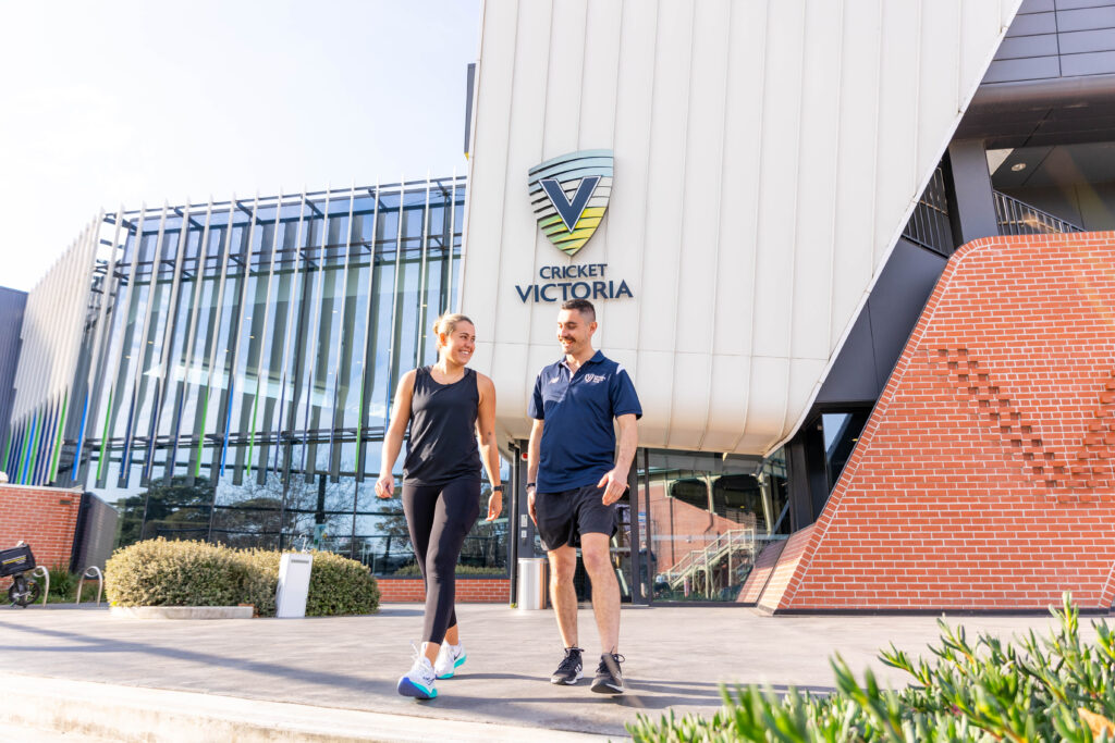Gym member and staff member walk out of Victoria Health Club